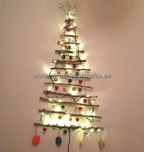 christmas tree with lamps and tree branch
