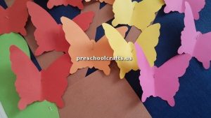 Make butterfly with colored paper for preschooler